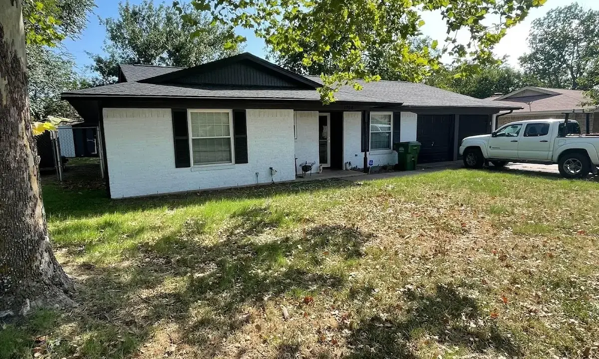 Professional roofing crew working on a residential roof in Jennings Lodge